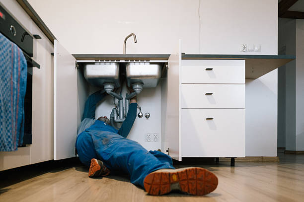 Professional Drain Cleaning technician working in Flint, MI